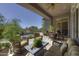 Inviting covered patio offers comfortable seating and views of the outdoor pool at 9671 E Cavalry Dr, Scottsdale, AZ 85262