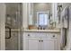 Bathroom featuring a vanity with white cabinetry, shower and neutral color palette at 9671 E West View Dr, Scottsdale, AZ 85255
