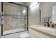 Well-lit bathroom features a glass-enclosed shower, neutral tile, and modern fixtures offering a clean and functional space at 9671 E West View Dr, Scottsdale, AZ 85255