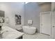Bright bathroom featuring modern fixtures, stylish decor, and a luxurious freestanding soaking tub under a skylight at 9671 E West View Dr, Scottsdale, AZ 85255