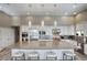 Spacious kitchen featuring stainless steel appliances, granite countertops, and a large island with seating, ideal for gatherings at 9671 E West View Dr, Scottsdale, AZ 85255