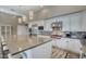 Elegant kitchen with stainless steel appliances, granite countertops, a large island with seating, and ample cabinet space at 9671 E West View Dr, Scottsdale, AZ 85255