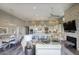Open-concept living area showcasing a modern kitchen, dining space, cozy seating, and a fireplace for a warm and inviting atmosphere at 9671 E West View Dr, Scottsdale, AZ 85255