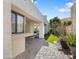 Paved backyard with covered patio, beautiful garden, and well-maintained exterior at 10076 E Calle De Cielo E Cir, Scottsdale, AZ 85258