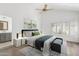 Modern bedroom with blue and white accents, natural light, and wood floors at 10076 E Calle De Cielo E Cir, Scottsdale, AZ 85258