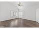 Bedroom with vaulted ceiling, hardwood floors, bright white walls, and plantation shutters at 10076 E Calle De Cielo E Cir, Scottsdale, AZ 85258