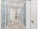 A walk-in closet with full-length mirrored and glass doors, with built-in shelving and drawer storage at 10076 E Calle De Cielo E Cir, Scottsdale, AZ 85258