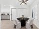 Cozy dining area with a round table, modern chairs, and a ceiling fan at 10076 E Calle De Cielo E Cir, Scottsdale, AZ 85258