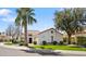 Attractive white home with a red tile roof, manicured lawn, and mature landscaping at 10076 E Calle De Cielo E Cir, Scottsdale, AZ 85258