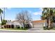 Charming single-story home featuring a white stucco exterior, red tile roof, and lush landscaping at 10076 E Calle De Cielo E Cir, Scottsdale, AZ 85258