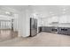 Modern kitchen with white cabinets, gray island, stainless steel appliances, and tile flooring at 10076 E Calle De Cielo E Cir, Scottsdale, AZ 85258