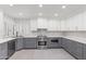 Modern kitchen featuring stainless steel appliances, grey cabinets, quartz countertops, and stylish backsplash at 10076 E Calle De Cielo E Cir, Scottsdale, AZ 85258