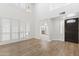 Bright living room featuring wood flooring, a high ceiling, and plenty of natural light at 10076 E Calle De Cielo E Cir, Scottsdale, AZ 85258