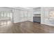 Open living space with hardwood flooring and a custom bar at 10076 E Calle De Cielo E Cir, Scottsdale, AZ 85258