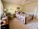 Inviting bedroom featuring a comfortable bed and ample natural light at 10323 W Deanne Dr, Sun City, AZ 85351