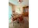 Cozy dining room with a wood table and chairs at 10323 W Deanne Dr, Sun City, AZ 85351