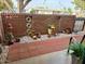 Lovely front patio area with decorative brickwork and beautiful plants at 10323 W Deanne Dr, Sun City, AZ 85351