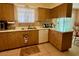 The kitchen features tile flooring and ample cabinet space at 10323 W Deanne Dr, Sun City, AZ 85351