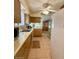 The kitchen features tile flooring and ample cabinet space at 10323 W Deanne Dr, Sun City, AZ 85351
