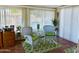 Bright sun room with wicker furniture, ideal for relaxation at 10323 W Deanne Dr, Sun City, AZ 85351