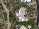Stunning aerial view of a sprawling home featuring a private pool and a desert landscape at 10379 E White Feather Ln, Scottsdale, AZ 85262