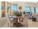 Breakfast nook featuring a round table with seating, large windows, and bright natural light at 10379 E White Feather Ln, Scottsdale, AZ 85262