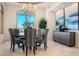 Elegant dining room featuring a chandelier, modern furnishings, and bright natural light at 10379 E White Feather Ln, Scottsdale, AZ 85262