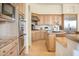 Bright kitchen features stainless steel appliances and a large kitchen island at 10379 E White Feather Ln, Scottsdale, AZ 85262