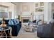Inviting living room featuring a cozy fireplace, stylish furniture, and ample natural light at 10379 E White Feather Ln, Scottsdale, AZ 85262