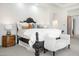 Bright main bedroom with a decorative accent wall and plush furnishings at 10379 E White Feather Ln, Scottsdale, AZ 85262