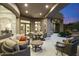 Luxurious outdoor patio area with comfortable seating, dining table, and serene desert views at 10379 E White Feather Ln, Scottsdale, AZ 85262