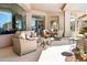 Spacious patio featuring comfortable seating, a dining area, and an outdoor grill at 10379 E White Feather Ln, Scottsdale, AZ 85262