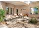 Relaxing outdoor patio with comfortable seating, decorative plants, and a peaceful ambiance at 10379 E White Feather Ln, Scottsdale, AZ 85262
