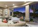 Inviting covered patio with ample seating, perfect for enjoying the pool and mountain views at 10379 E White Feather Ln, Scottsdale, AZ 85262