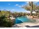 Sparkling pool surrounded by lush landscaping, creating a private oasis for relaxation and recreation at 10379 E White Feather Ln, Scottsdale, AZ 85262