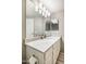 Modern bathroom featuring a stylish vanity with stunning countertops, contemporary lights, and a large mirror at 10410 N Cave Creek Rd # 2114, Phoenix, AZ 85020