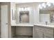 Bright bathroom boasts marble countertops, vanity, and shower with modern fixtures at 10410 N Cave Creek Rd # 2114, Phoenix, AZ 85020
