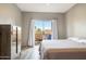 Bedroom featuring a dresser and walk out private patio area with seating at 10410 N Cave Creek Rd # 2114, Phoenix, AZ 85020