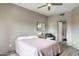 Bedroom features a queen bed, ceiling fan, and access to a Primary bathroom at 10410 N Cave Creek Rd # 2114, Phoenix, AZ 85020