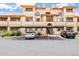 Beautiful condo complex featuring stucco walls, balconies, covered parking, and desert landscaping at 10410 N Cave Creek Rd # 2114, Phoenix, AZ 85020