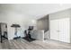 Workout room boasts a Peloton bike and fitness equipment with light gray walls and vinyl flooring at 10410 N Cave Creek Rd # 2114, Phoenix, AZ 85020