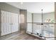 Upstairs hallway featuring access to bedroom and a large window overlooking neighborhood at 10410 N Cave Creek Rd # 2114, Phoenix, AZ 85020