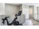 Upstairs hallway featuring a Peloton bike in the corner and a view to the interior of the home at 10410 N Cave Creek Rd # 2114, Phoenix, AZ 85020