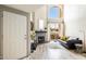 Open living room with vaulted ceilings, wood floors, fireplace, and access to balcony at 10410 N Cave Creek Rd # 2114, Phoenix, AZ 85020