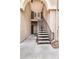 Exterior staircase leading to the units with covered archway and neutral color scheme at 10410 N Cave Creek Rd # 2114, Phoenix, AZ 85020