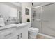 Clean bathroom with a shower and a single sink vanity, and tile floor at 10414 N 105Th Ave, Sun City, AZ 85351