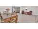 Charming dining area adjacent to the living room offers a rustic wooden table at 10414 N 105Th Ave, Sun City, AZ 85351