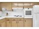 Charming kitchen features tiled backsplash, light wood cabinets, and modern appliances at 10414 N 105Th Ave, Sun City, AZ 85351