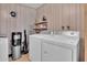 Well-equipped laundry room with modern washer, dryer, and ample storage space at 10414 N 105Th Ave, Sun City, AZ 85351