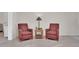 Relaxing living room with tile floors, comfortable chairs, and a decorative table lamp at 10414 N 105Th Ave, Sun City, AZ 85351